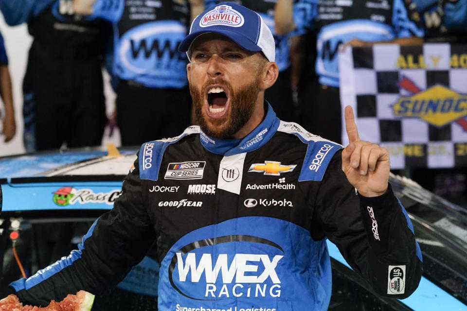 Ross Chastain celebrates after winning a NASCAR Cup Series auto race, Sunday, June 25, 2023, in Lebanon, Tenn. (AP Photo/George Walker IV)
