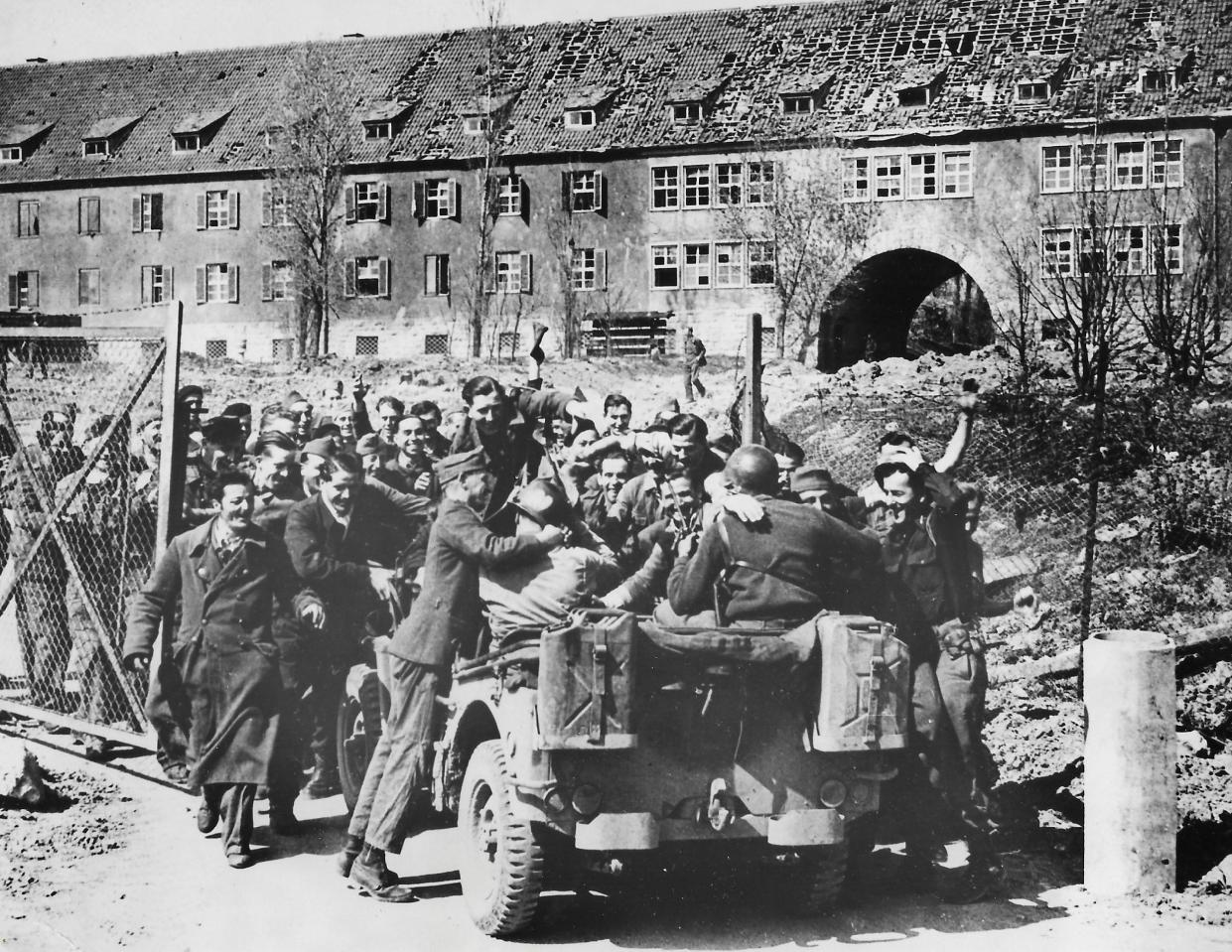 French prisoners of war greet advancing U.S. troops in the German town of Kitzingen on April 21, 1945. More than 400 soldiers were at the prison camp. Some had been held captive for five years.