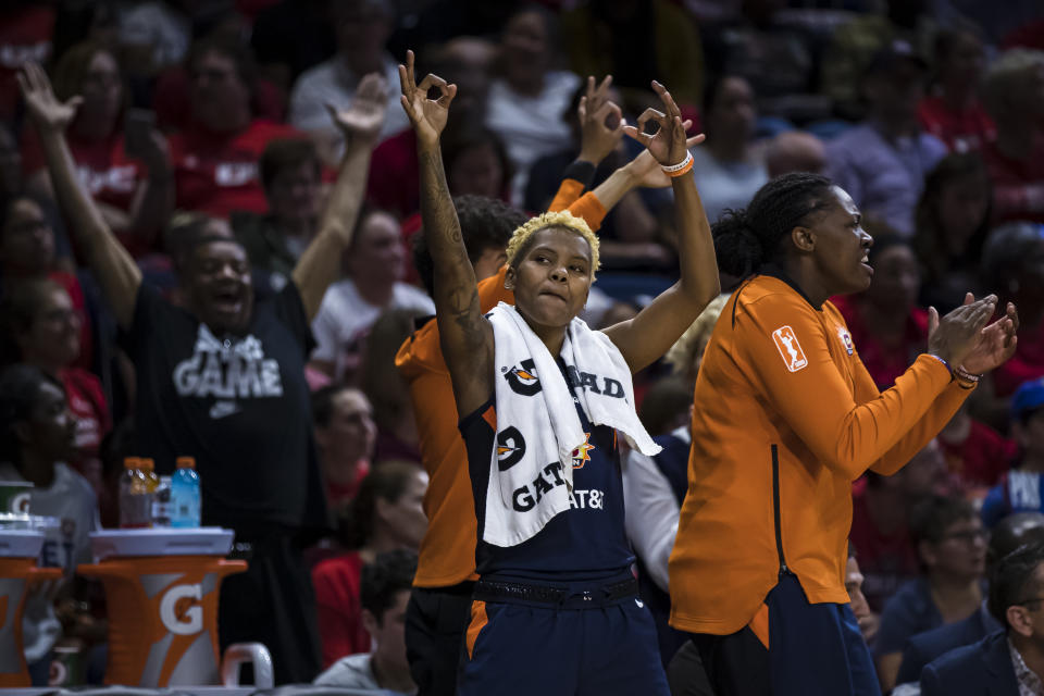 WASHINGTON, DC - OCTOBER 01: Courtney Williams #10 of the Connecticut Sun celebrates with teammates against the Washington Mystics during the first half of Game Two of the 2019 WNBA finals at St Elizabeths East Entertainment & Sports Arena on October 1, 2019 in Washington, DC. NOTE TO USER: User expressly acknowledges and agrees that, by downloading and or using this photograph, User is consenting to the terms and conditions of the Getty Images License Agreement. (Photo by Scott Taetsch/Getty Images)