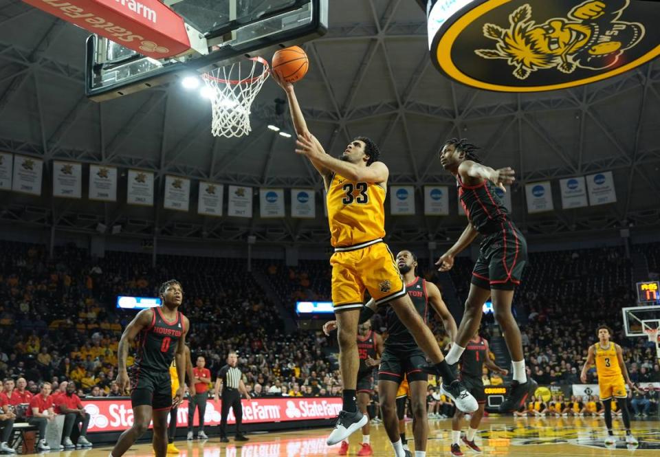 Wichita State University’s James Rojas scores in the first half against the University of Houston during their game at Koch Arena.