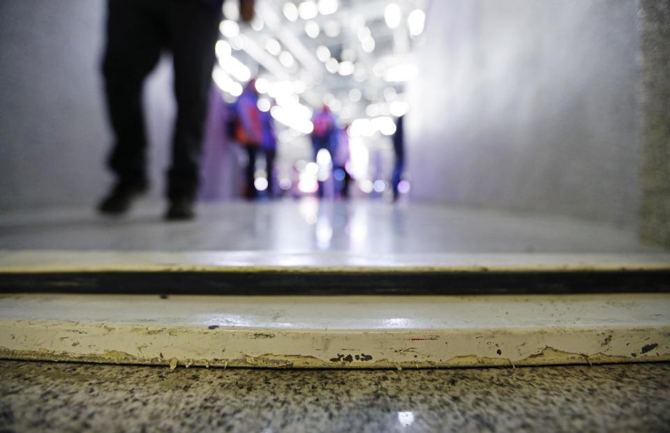 A door frame raised from the floor lies across an entrance to wheelchair seating at the Bolshoy Ice Dome at the 2014 Winter Olympics, Tuesday, Feb. 18, 2014, in Sochi, Russia. Olympic organizers have repeatedly touted accessibility for people with disabilities as one of the chief lasting benefits of hosting the Winter Games in Sochi. But with less than three weeks until the Paralympics, infrastructure around Olympic Park and its venues are not entirely barrier-free. (AP Photo/David Goldman)