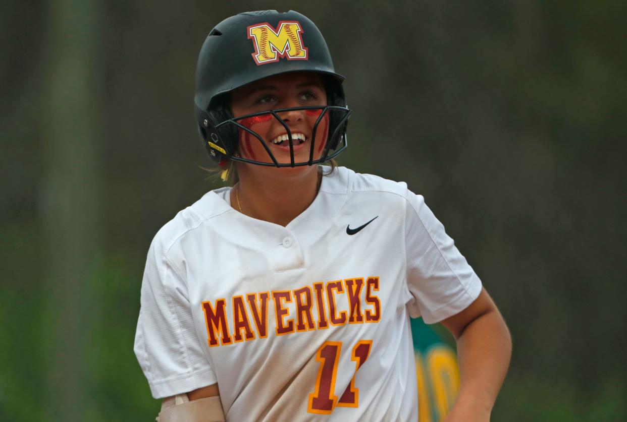 McCutcheon Mavericks Kaidynn Peckinpaugh (11) smiles during the IHSAA softball game against the Benton Central Bison, Tuesday, April 16, 2024, at McCutcheon High School in Lafayette, Ind.