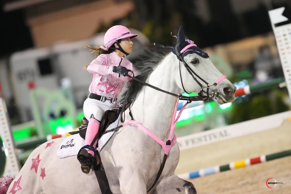 Taylor Land and Kenai compete in the Winter Equestrian Festival's season-opening "Saturday Night Lights" $75,000 Battle of the Sexes at Wellington International.