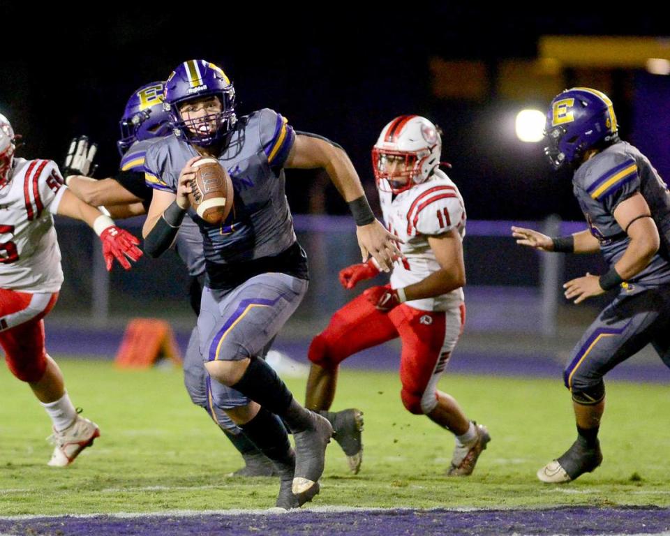 Escalon quarterback Donovan Rozevink (7) scrambles out of the pocket during a game between Escalon High School and Ripon High School in Escalon, California on October 20, 2023. 