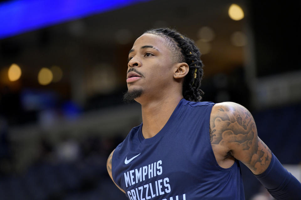 Memphis Grizzlies guard Ja Morant warms up before an NBA basketball game against the Indiana Pacers Thursday, Dec. 21, 2023, in Memphis, Tenn. (AP Photo/Brandon Dill)