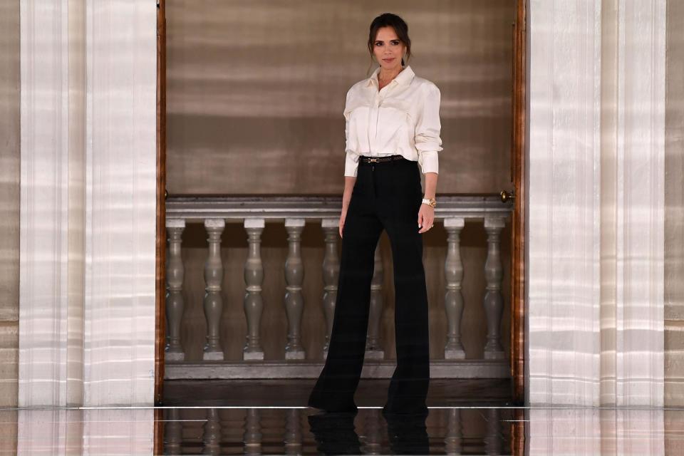 British fashion designer Victoria Beckham reacts after presenting creations for her Autumn/Winter 2020 collection on the third day of London Fashion Week in London on February 16, 2020. (Getty Images)
