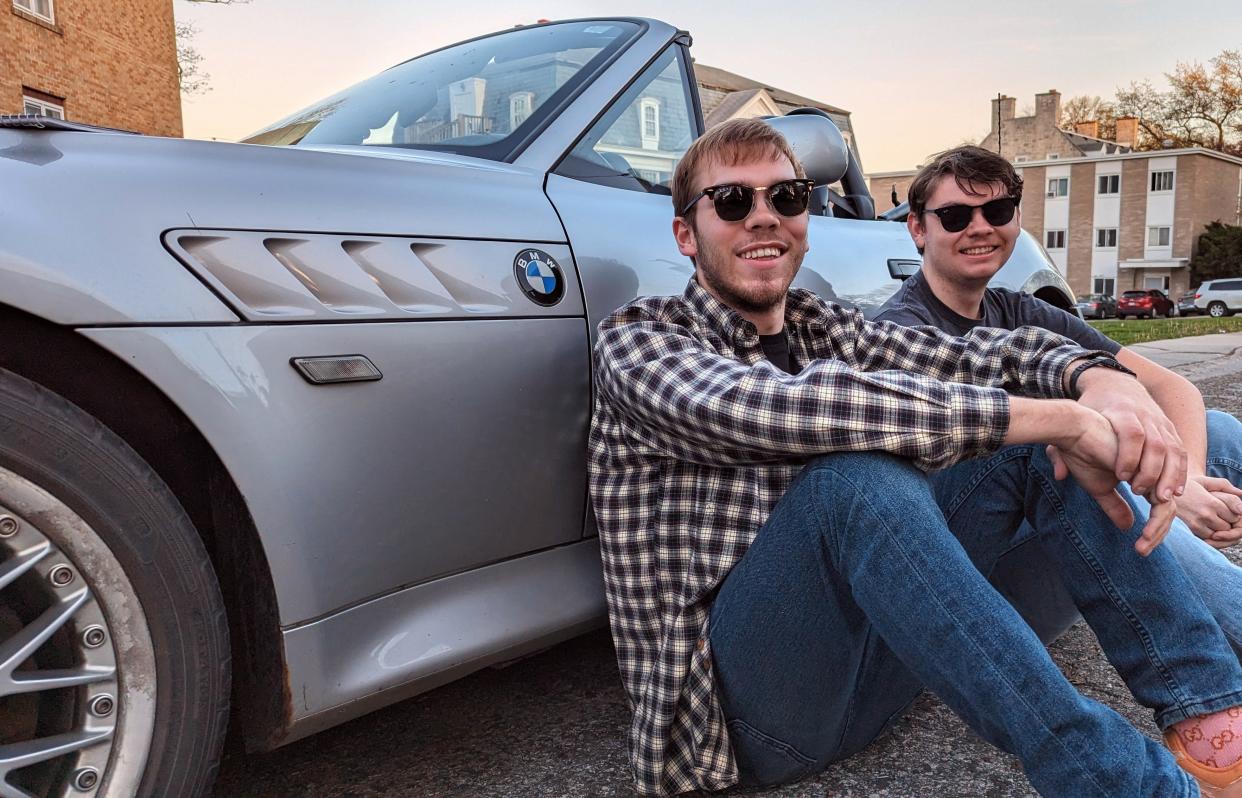 Max Henning of Iowa City (left) and Alex Richter of Coralville are part of a team driving a historic 1924 Ford Model T some 3,000 miles across the nation this June. They are shown here with Henning's 2001 BMW Z3 Roadster, a far cry from the 100-year-old antique being prepared for the journey.