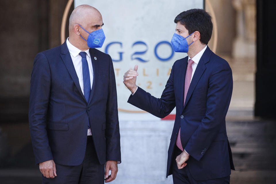 Swiss Health Minister Alain Berset, left, and Italian Minister Roberto Speranza share a word at the start of a G20 meeting in Rome, Saturday, Sept. 5, 2021. (Roberto Monaldo/LaPresse via AP)