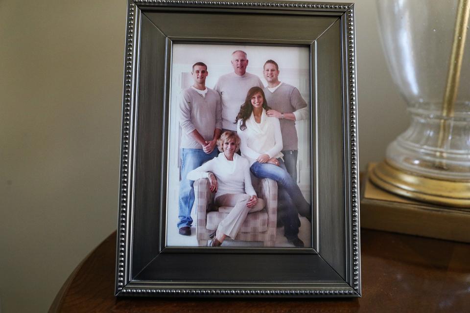 A framed photo of former IU basketball standout Ted Kitchel with his family, sons Tyler (left) and Scott (right), daughter Mackenzie, and wife Kristi (seated), at his Greenwood home Thursday, August 5, 2021.
