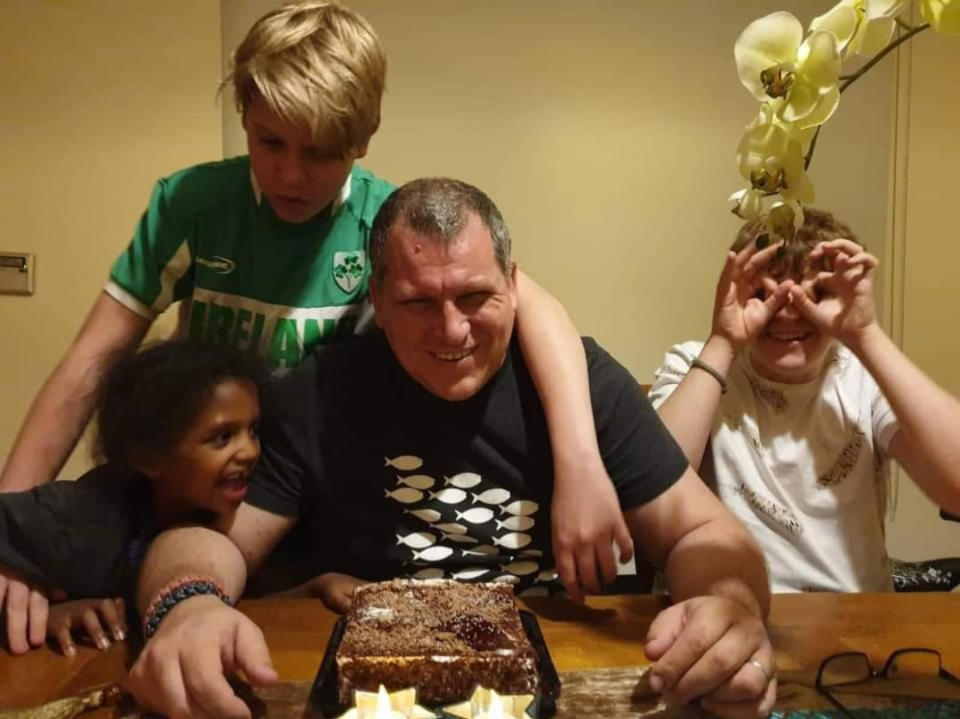 Irish engineer Robert Pether pictured with his three children and a cake. Source: Newsflash/Australscope