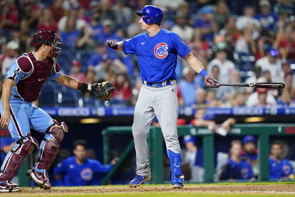 Chicago Cubs' Frank Schwindel, right, reacts after striking out against Philadelphia Phillies pitcher Hector Neris during the sixth inning of a baseball game, Thursday, Sept. 16, 2021, in Philadelphia. (AP Photo/Matt Slocum)