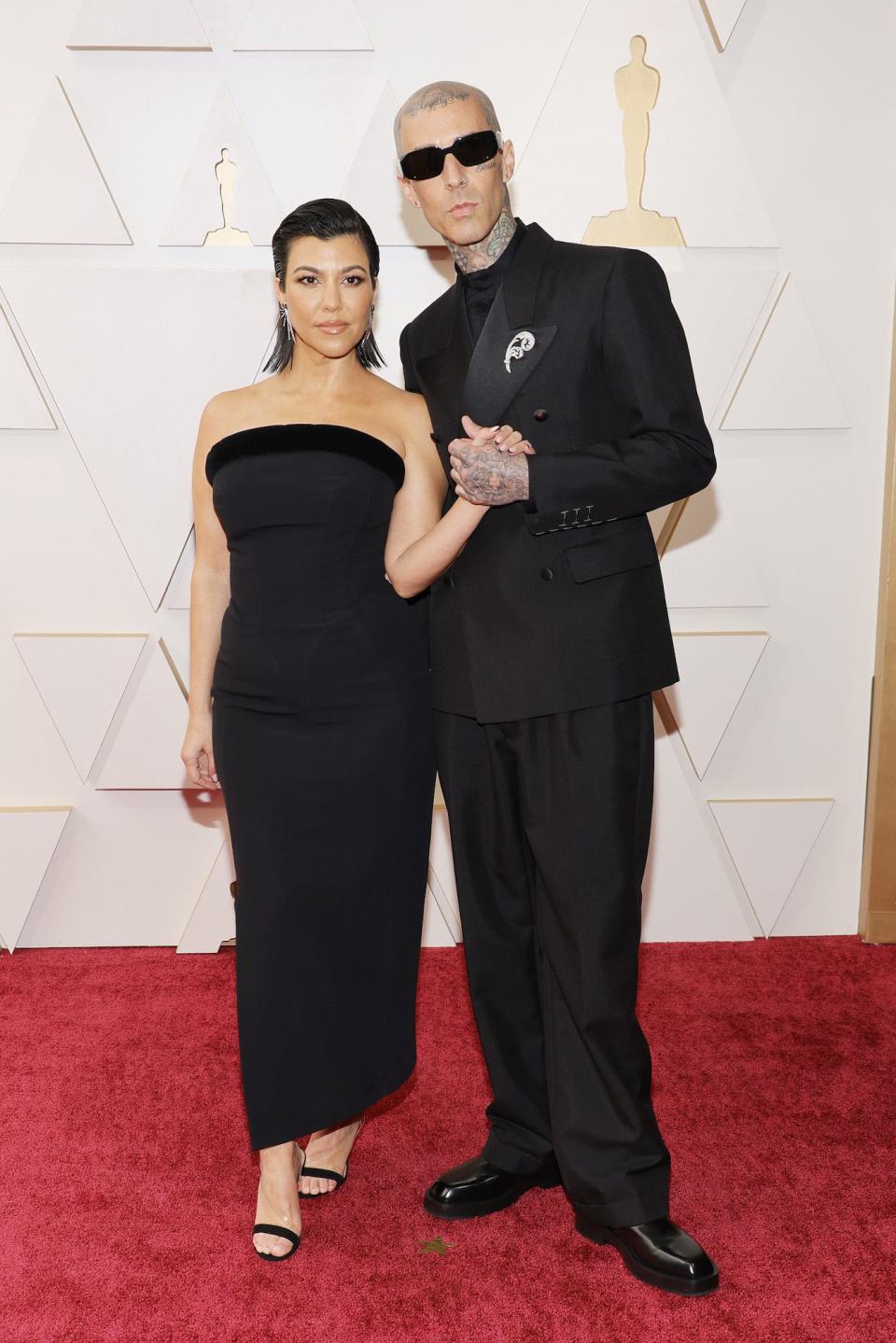 Kourtney Kardashian and Travis Barker at the 2022 Oscars.