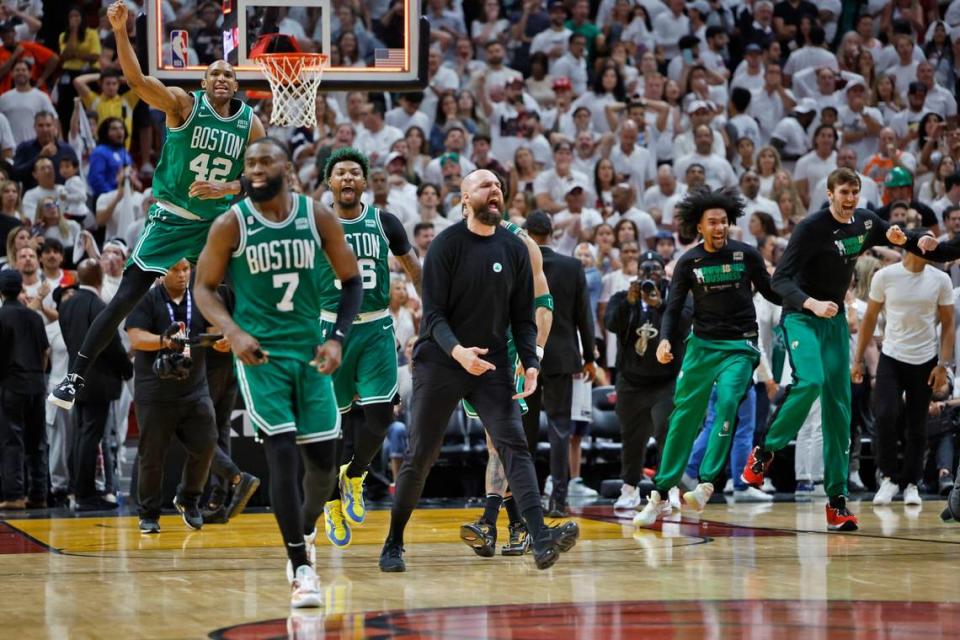 The Boston Celtics react after defeating the Miami Heat in the final seconds of Game 6 of the Eastern Conference finals at the Kaseya Center in Miami on Saturday, May 27, 2023.