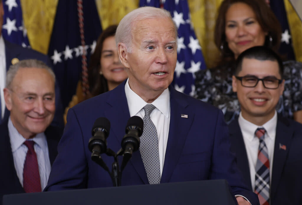 President Joe Biden speaks at an event marking the 12th anniversary of the Deferred Action for Childhood Arrivals program in the East Room at the White House on June 18, 2024, in Washington, D.C. At left is Senate Majority Leader Chuck Schumer, D-N.Y. (Kevin Dietsch/Getty Images)