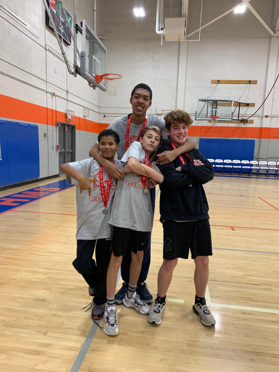 Specialolympicsphoto4: Gresham Middle School’s unified Special Olympics baseball team, from left: Malek Harris, Gavin Woods, Kennis Brown (back), Brayden Starnes (athletes and peer tutors). “Most of the county schools tried to keep student interaction as policy would allow,” said Rachel Babelay, of the COVID restrictions. “Sometimes it was difficult to have interaction and the big Special Olympics meets. Their ability to function with their peers has been greatly impacted. We integrate as much as we can so they can gain some interpersonal, relational skills.”