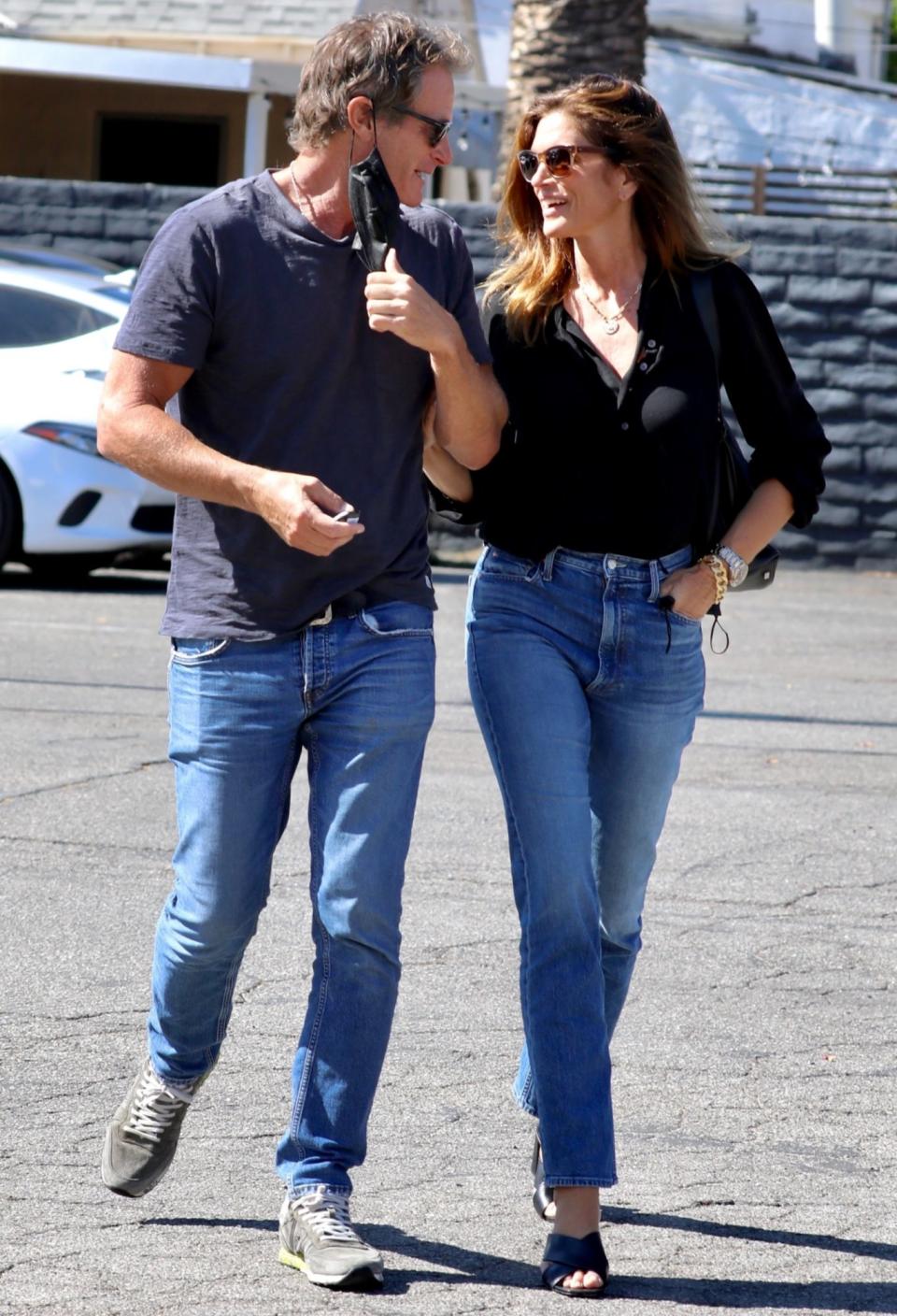 <p>Rande Gerber and Cindy Crawford share a sweet moment while shopping in West Hollywood on July 29.</p>