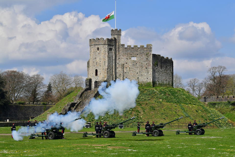 Members of the 104th Regiment Royal Artillery fire a 41-round gun salute in the grounds of Cardiff Castle, to mark the death of Prince Philip, in Cardiff, Saturday, April 10, 2021. Britain's Prince Philip, the irascible and tough-minded husband of Queen Elizabeth II who spent more than seven decades supporting his wife in a role that mostly defined his life, died on Friday. (Ben Birchall/PA via AP)