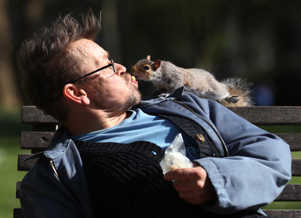 Bobby (no surname given) feeding a peanut to a squirrel in St James's Park, London, as the UK continues in lockdown to help curb the spread of the coronavirus.