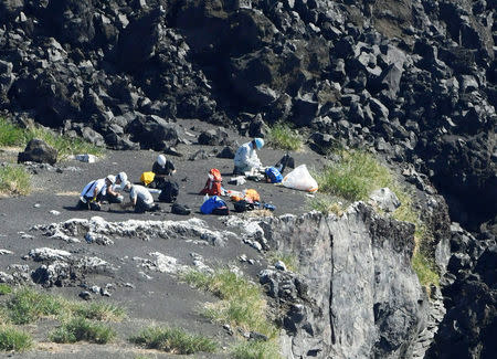 A aerial view shows researchers conducting surveillance activities for the first time since its eruption in 2013, on the pacific island of Nishinoshima, also known as Rosario Island, some 1,000 kilometers south of Tokyo, Japan October 20, 2016. Mandatory credit Kyodo/via REUTERS