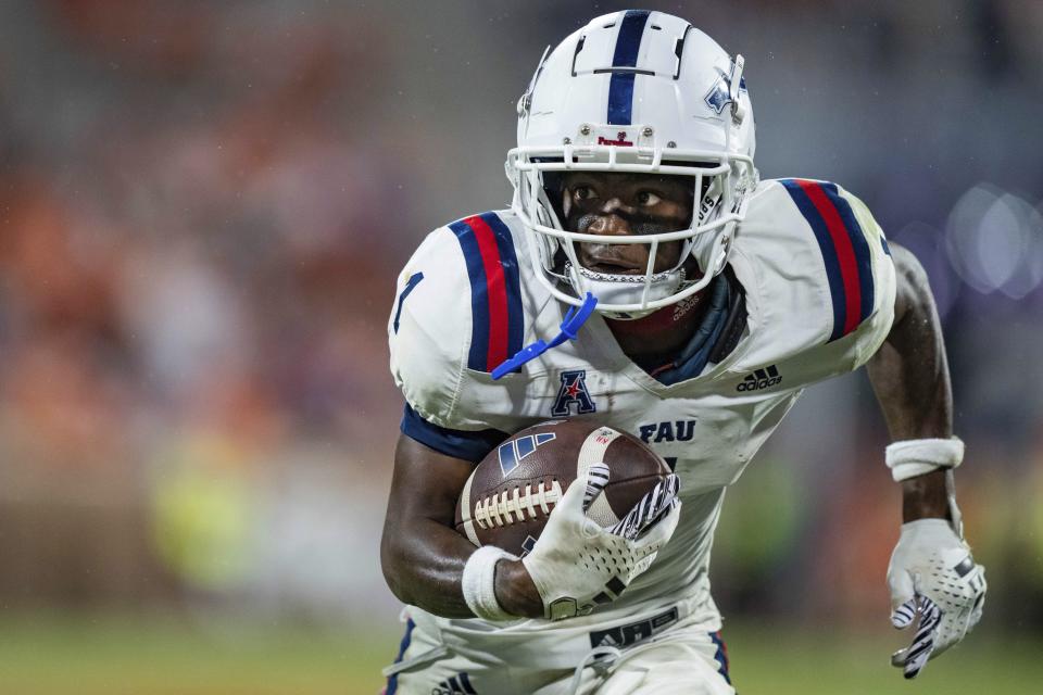 Florida Atlantic wide receiver LaJohntay Wester runs with the ball during the second half of an NCAA college football game against Clemson, Saturday, Sept. 16, 2023, in Clemson, S.C. (AP Photo/Jacob Kupferman)