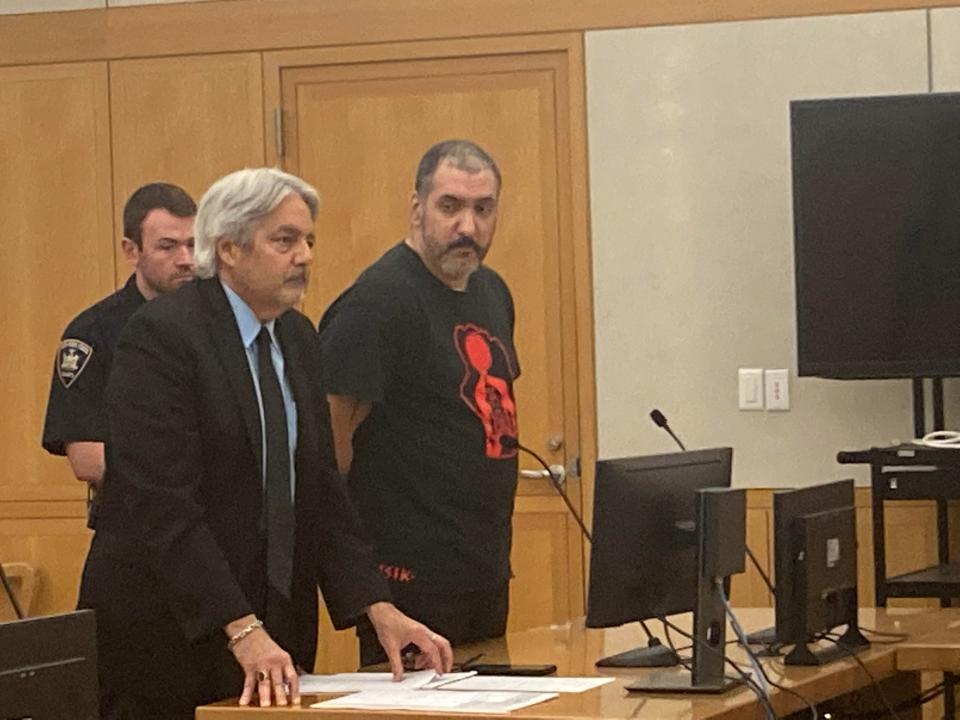 Rafael Ramos, right, at his arraignment in Westchester County Court June 14, 2023, after his lawyer, Vincent deMarte entered a not guilty plea on a charge of second-degree murder in the March 9, 1997, killing of Ramos' estranged wife Nusinaida Ramos in her Yonkers apartment.