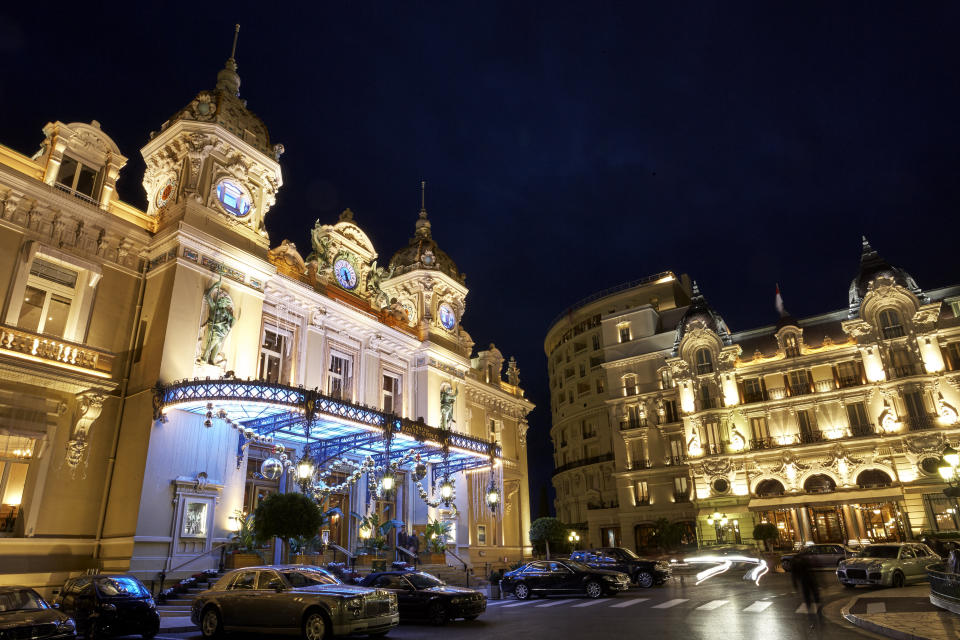 Facade of 'Monte Carlo casino' gambling and entertainment complex illumimated at night opened in 1863. Image: Getty