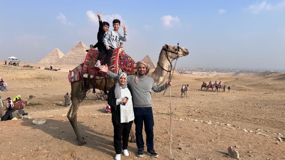 The Dahman family visit the Pyramids of Giza, in Egypt, on December 29. - Ibrahim Dahman/CNN