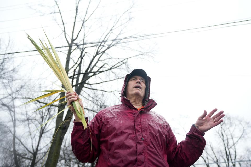 The Rev. John Algera prays during an Operation Cease Fire march on North Main Street in Paterson on Saturday, April 1, 2023.