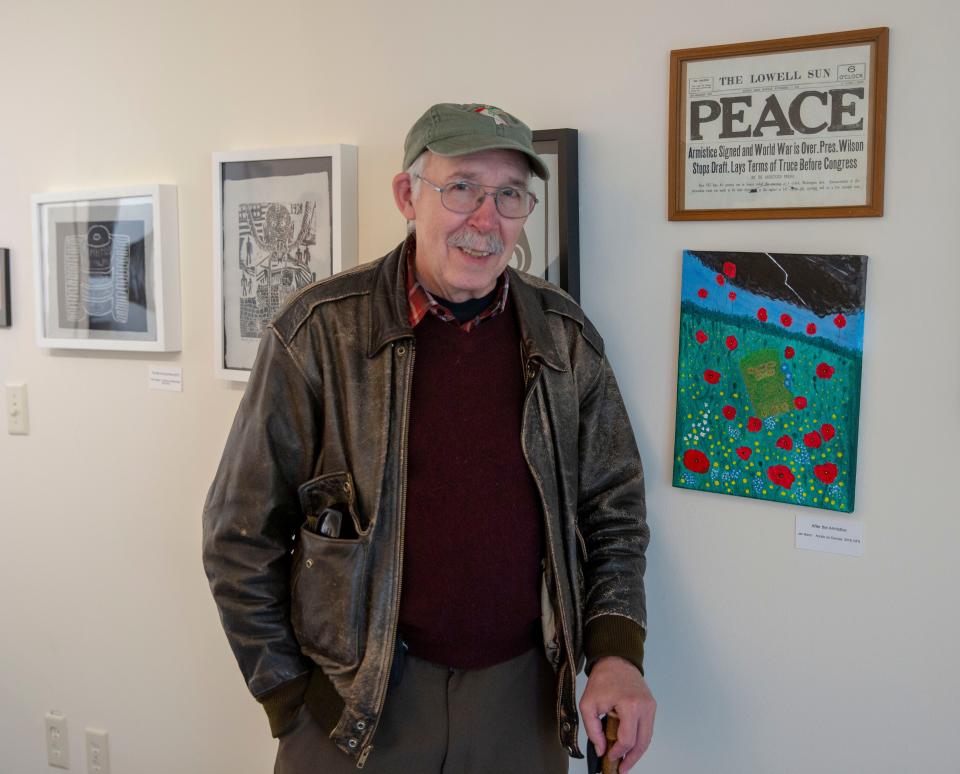 Jan Barry, former reporter/columinist at The Record and Ramapo College professor, in front of one of his pieces at the Armistice Day 2018 art Exhibit on November 10, 2018 at the The Puffiin Foundation in Teaneck, NJ.