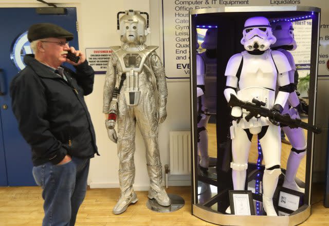 A member of the public view items of movie memorabilia seized from a drugs lord