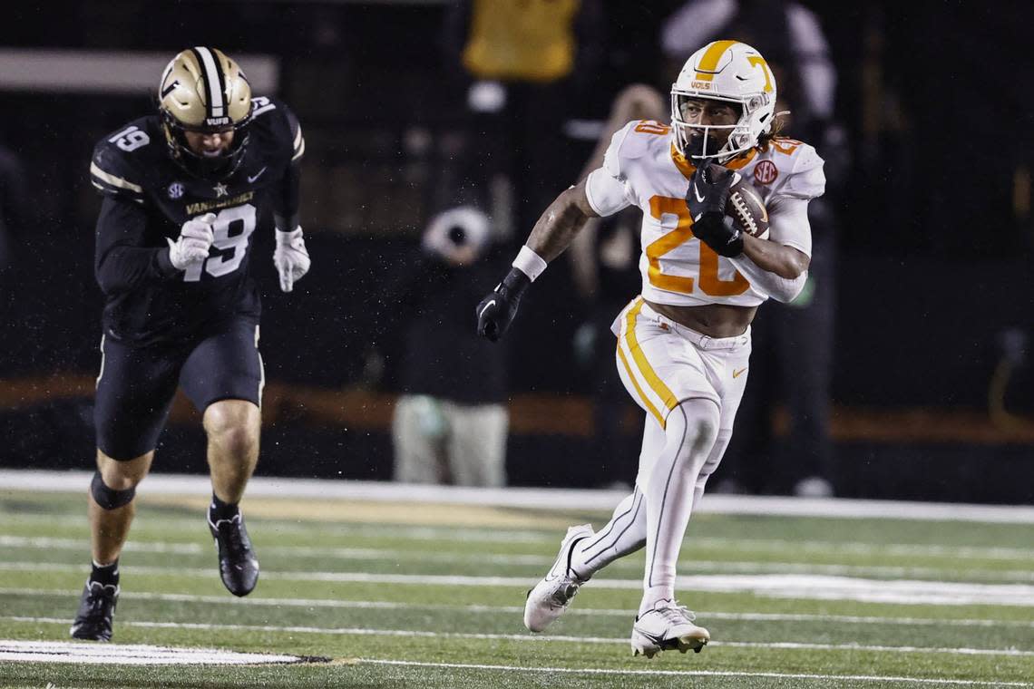 Tennessee running back Jaylen Wright (20) outruns Vanderbilt linebacker Kane Patterson (19) for a touchdown during the second half of an NCAA college football game Saturday, Nov. 26, 2022, in Nashville, Tenn.