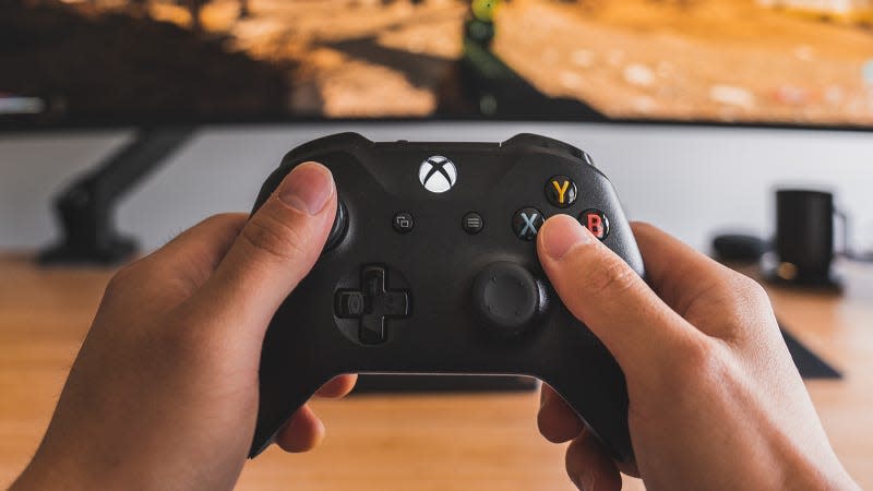 Hands holding an Xbox controller