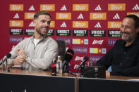 England midfielder Jordan Henderson, left, and Ajax trainer John van 't Schip are seen during a news conference in Amsterdam, Netherlands, Friday, Jan. 19, 2024. The lucrative Saudi soccer league lost one of its high-profile players when Henderson quit Al-Ettifaq to sign for struggling Dutch powerhouse Ajax. (AP Photo/Peter Dejong)