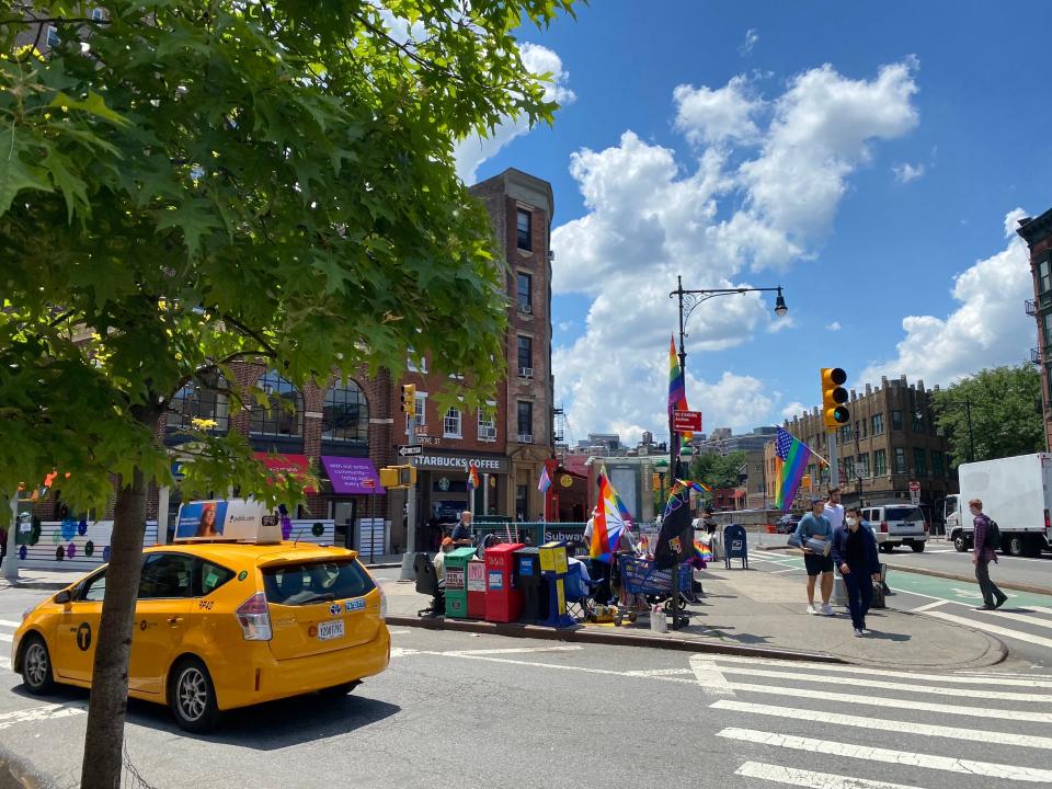 intersection in west village nyc covered in pride flags