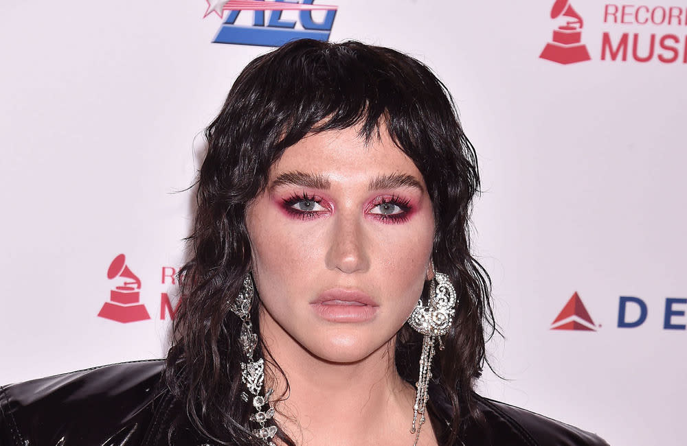 Kesha aims to only make music Dolly Parton would enjoy credit:Bang Showbiz