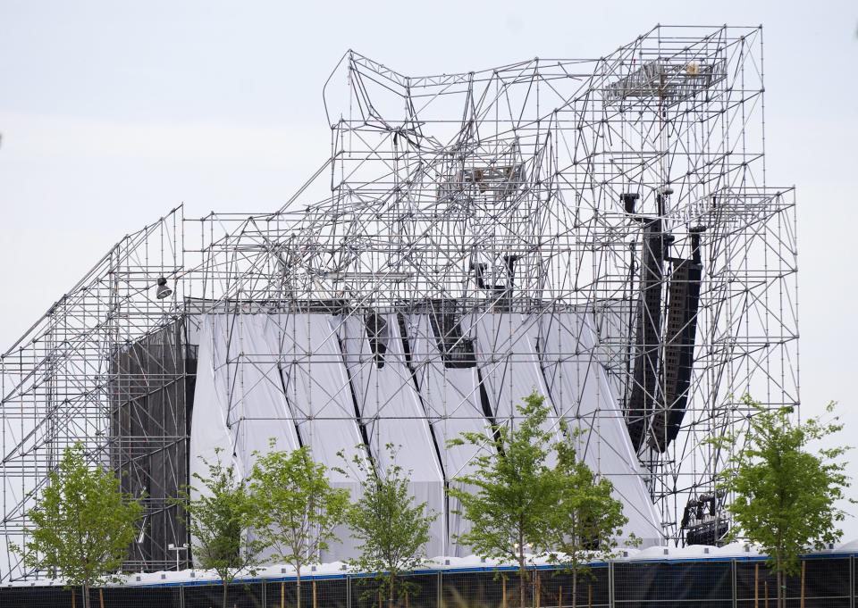 A stage intended for a Radiohead concert is collapsed at Downsview Park in Toronto on Saturday, June 16, 2012. Toronto paramedics say one person is dead and another is seriously hurt after the stage collapsed while setting up for a Radiohead concert. They say two other people were injured and are being assessed. (AP Photo/The Canadian Press, Nathan Denette)