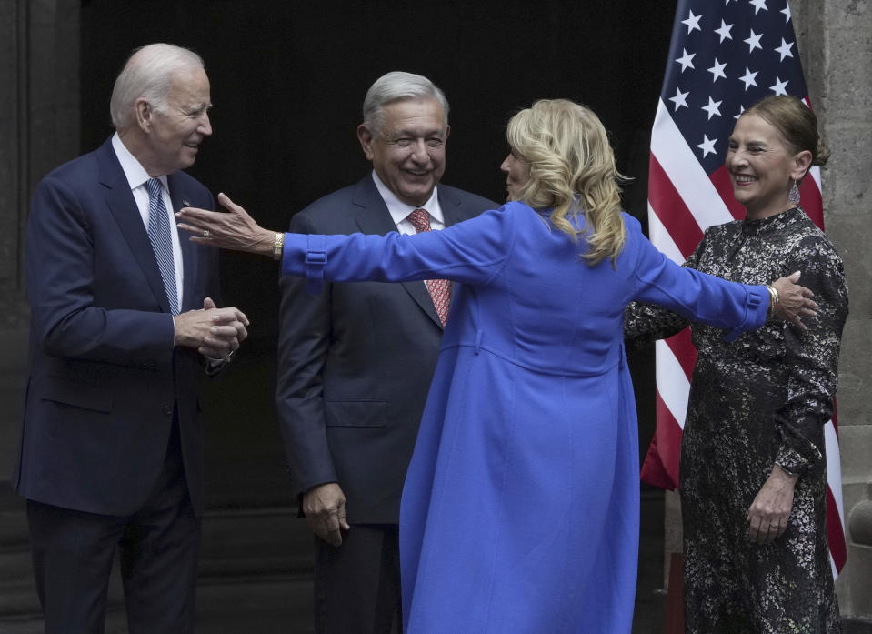 U.S. First Lady Jill Biden opens her arms to embrace Mexico's President Andres Manuel Lopez Obrador, his wife Beatriz Gutiérrez Müller, and U.S. President Joe Biden at the National Palace in Mexico City, Monday, Jan. 9, 2023. (AP Photo/Fernando Llano)