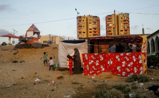 Hani and Noor al-Laham's financial woes have forced them to move to a homemade shack on the coast near Gaza City