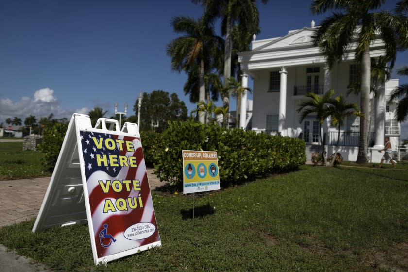 A man walks into City Hall, where early voting was in process, in Everglades City, Fla., Oct. 29