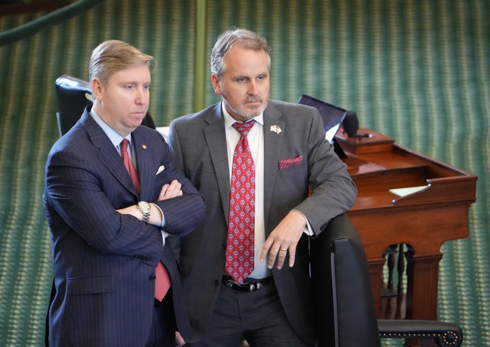 Sen. Tan Parker, R-Flower Mound, left, and Sen. Bryan Hughes , R-Mineola, talk Tuesday in the Senate. Hughes might be asked to testify in Ken Paxton's impeachment trial. House investigators say Paxton used Hughes as a "straw requestor" to issue a legal opinion to help Austin real estate developer Nate Paul avoid a foreclosure.