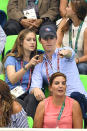 <p>Eddie and his wife are definitely making the most of their time at the Rio Olympics and enjoyed watching the swimming on day 4 in matching blue tops. <i>[Photo: Getty]</i></p>