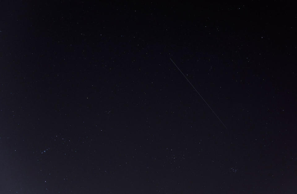 This photo of China's Tiangong-1 space station module streaking overhead was captured by Gianluca Masi of the Virtual Telescope Project in Rome on March 9, 2018. The spacecraft will fall to Earth between March 30 and April 1. The constellations Orion, Auriga and Taurus are also visible. <cite>Gianluca Masi/<a href="http://www.virtualtelescope.eu" rel="nofollow noopener" target="_blank" data-ylk="slk:Virtual Telescope Project;elm:context_link;itc:0;sec:content-canvas" class="link ">Virtual Telescope Project</a></cite>