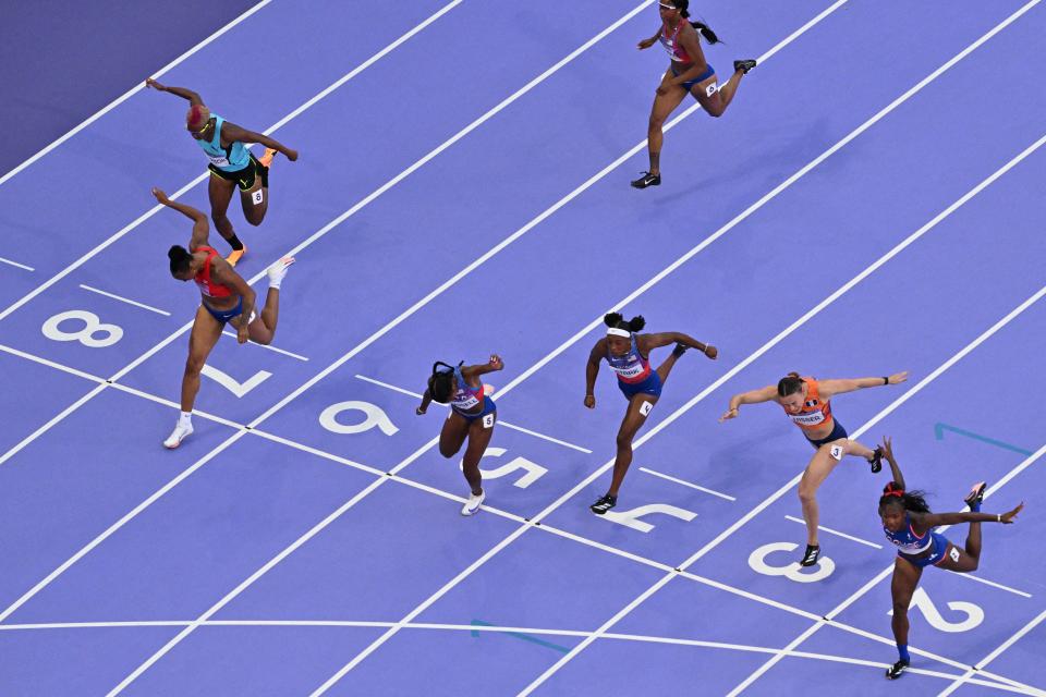 7 photos of Masai Russell's photo finish to win Olympic women's 100m