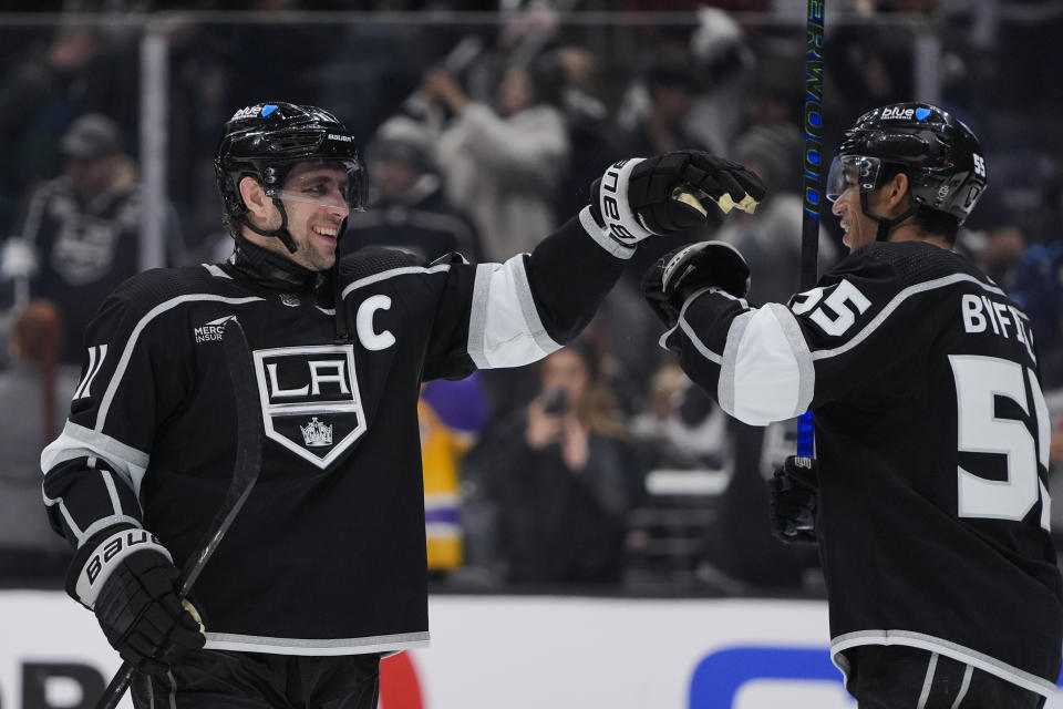 Los Angeles Kings center Anze Kopitar, left, celebrates with right wing Quinton Byfield after the team's win over the Columbus Blue Jackets in an NHL hockey game Tuesday, Feb. 20, 2024, in Los Angeles. (AP Photo/Ryan Sun)