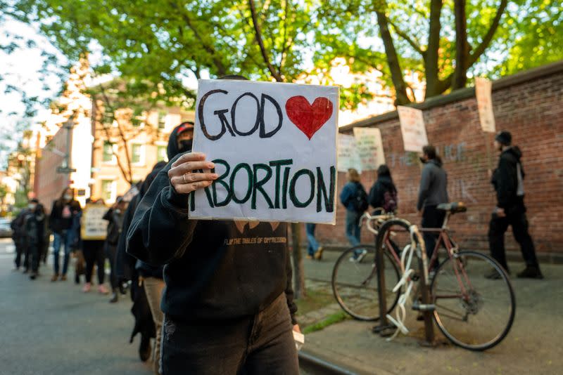 A person holds a sign during abortion rights counter protest in response to a monthly demonstration by members of the Catholic Church, in New York City