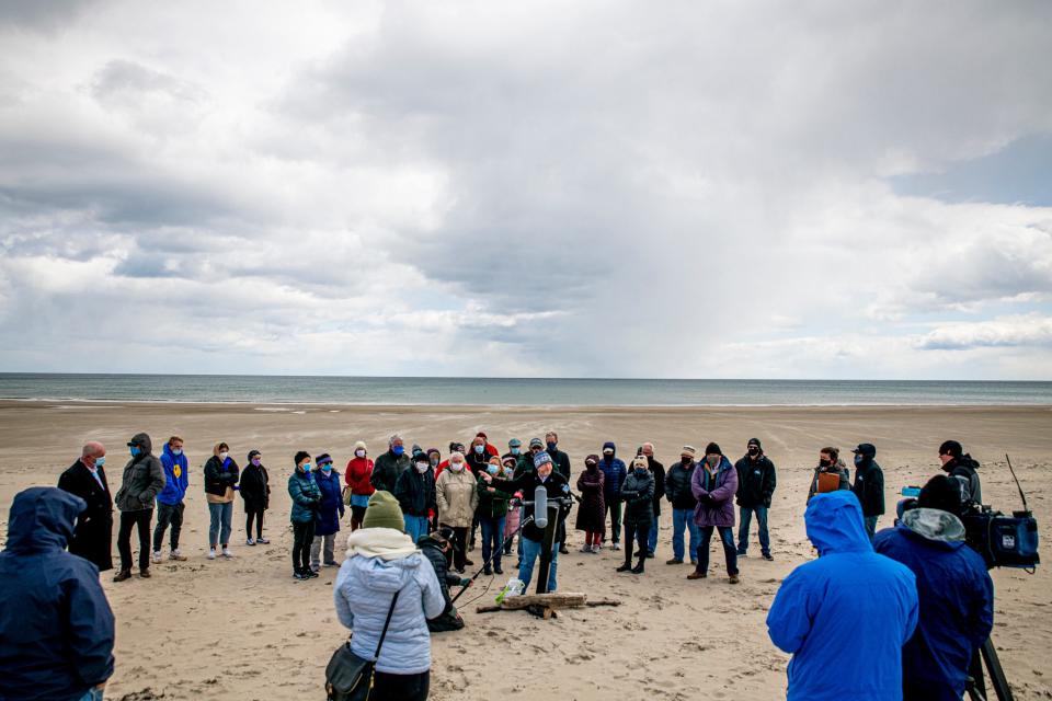 Benjamin E. Ford, a partner in the new Portland-based law firm Archipelago Law, holds a press conference Thursday, April 22, 2021, at the border of Moody Beach in Wells and North Beach in Ogunquit, after filing a lawsuit that he said aims to reclaim the intertidal zone of Maine beaches for public access. If successful, the case would overturn a decision made three decades ago by the Maine Supreme Judicial Court.