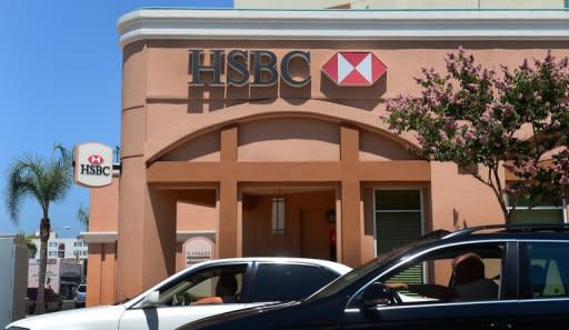 Drivers pass a branch of HSBC bank in Alhambra, east of downtown Los Angeles. Shares in global banking giant HSBC fell more than two percent in Hong Kong on Wednesday after a top executive resigned over the lender's failure to control money laundering and terrorist financing