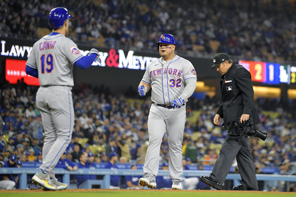 New York Mets' Daniel Vogelbach, right, celebrates with Mark Canha after hitting a two-run home run during the second inning of a baseball game against the Los Angeles Dodgers Monday, April 17, 2023, in Los Angeles. (AP Photo/Mark J. Terrill)