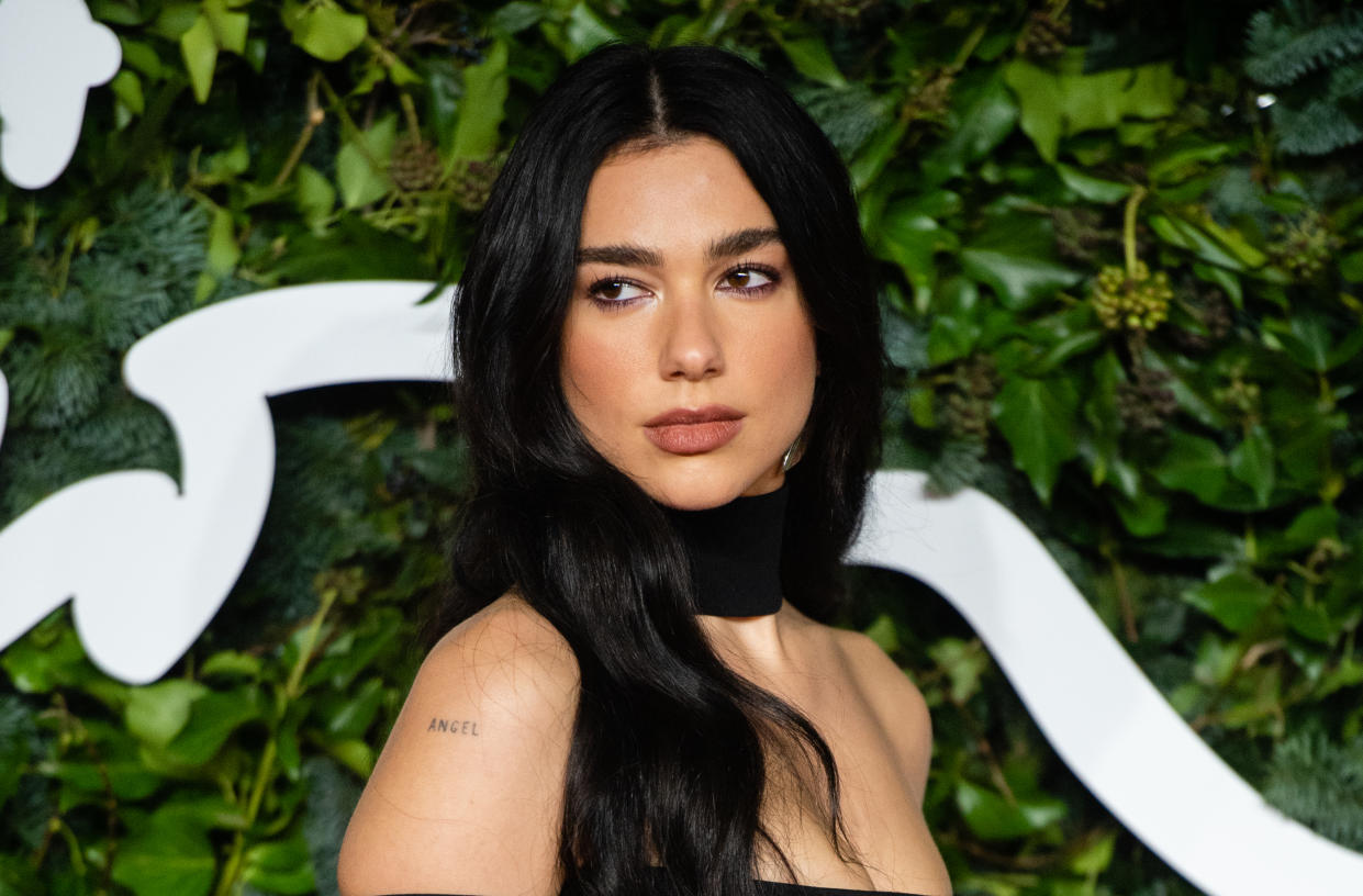 Dua Lipa sported extremely low-rise pants and a red bodysuit in a jaw-dropping new Instagram photo. (Photo: Samir Hussein/WireImage)
