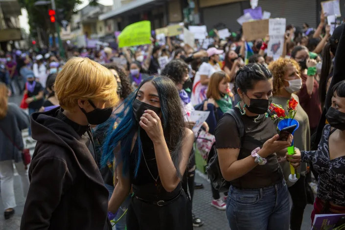 Women participate in a demonstration marking International Women's Day in downtown Guatemala City, Tuesday, March 8, 2022. (AP Photo/Oliver de Ros)